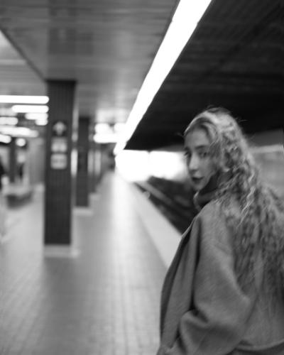 A Girl looking back with hair flying in the subway
