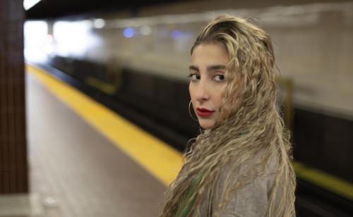 A Girl looking back with hair flying in the subway
